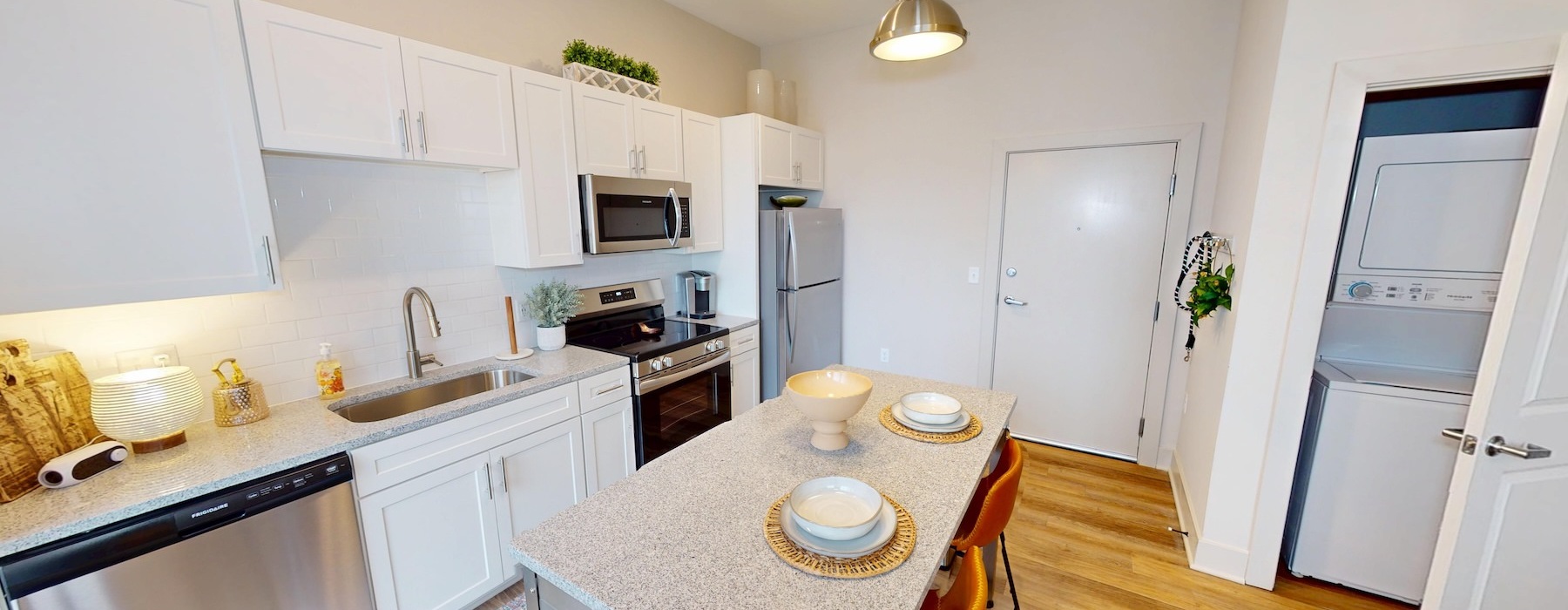 a kitchen with white cabinets