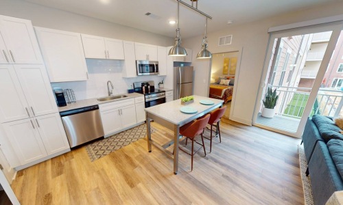 a kitchen with white cabinets