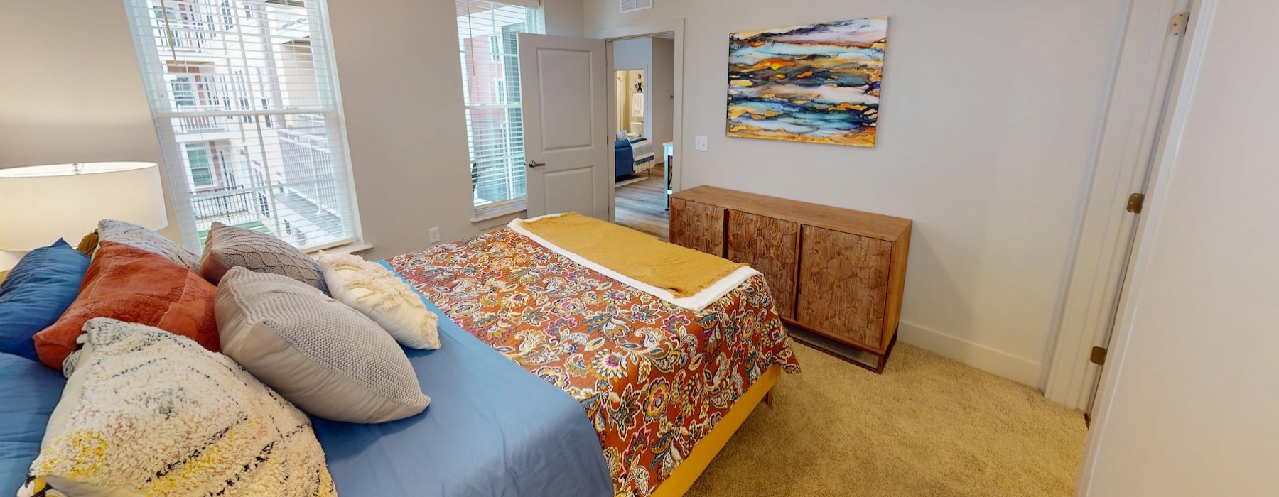 a bedroom with a bed and a dresser