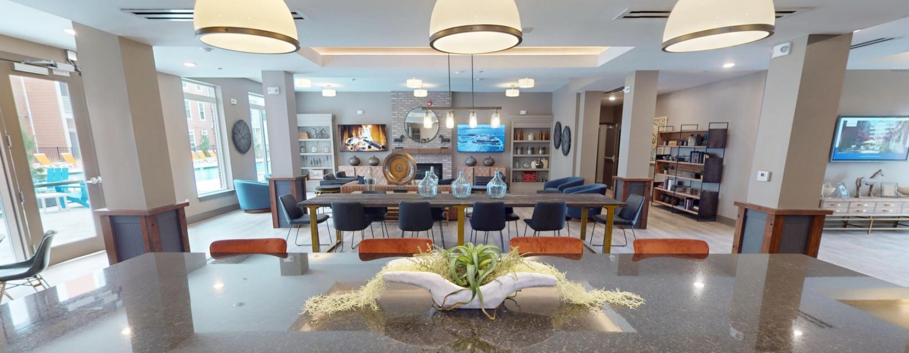 a lounge with tables and chairs