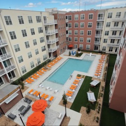 a pool with chairs around it