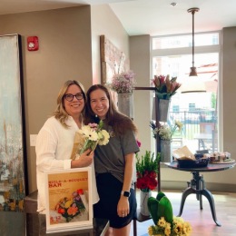 a couple of women smiling and posing indoors