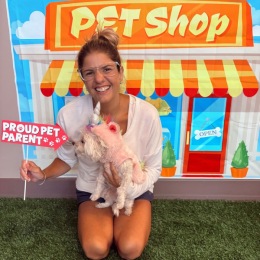 a woman with a dog posing